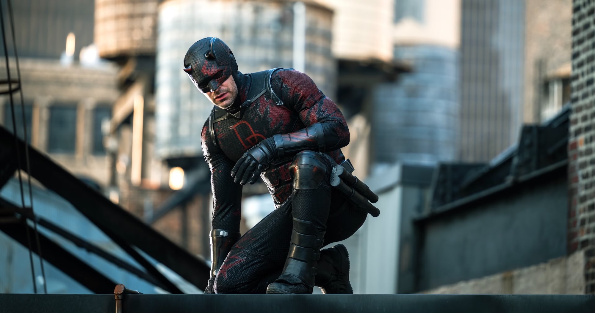 Daredevil crouches on a rooftop - promotional still from Daredevil: Born Again