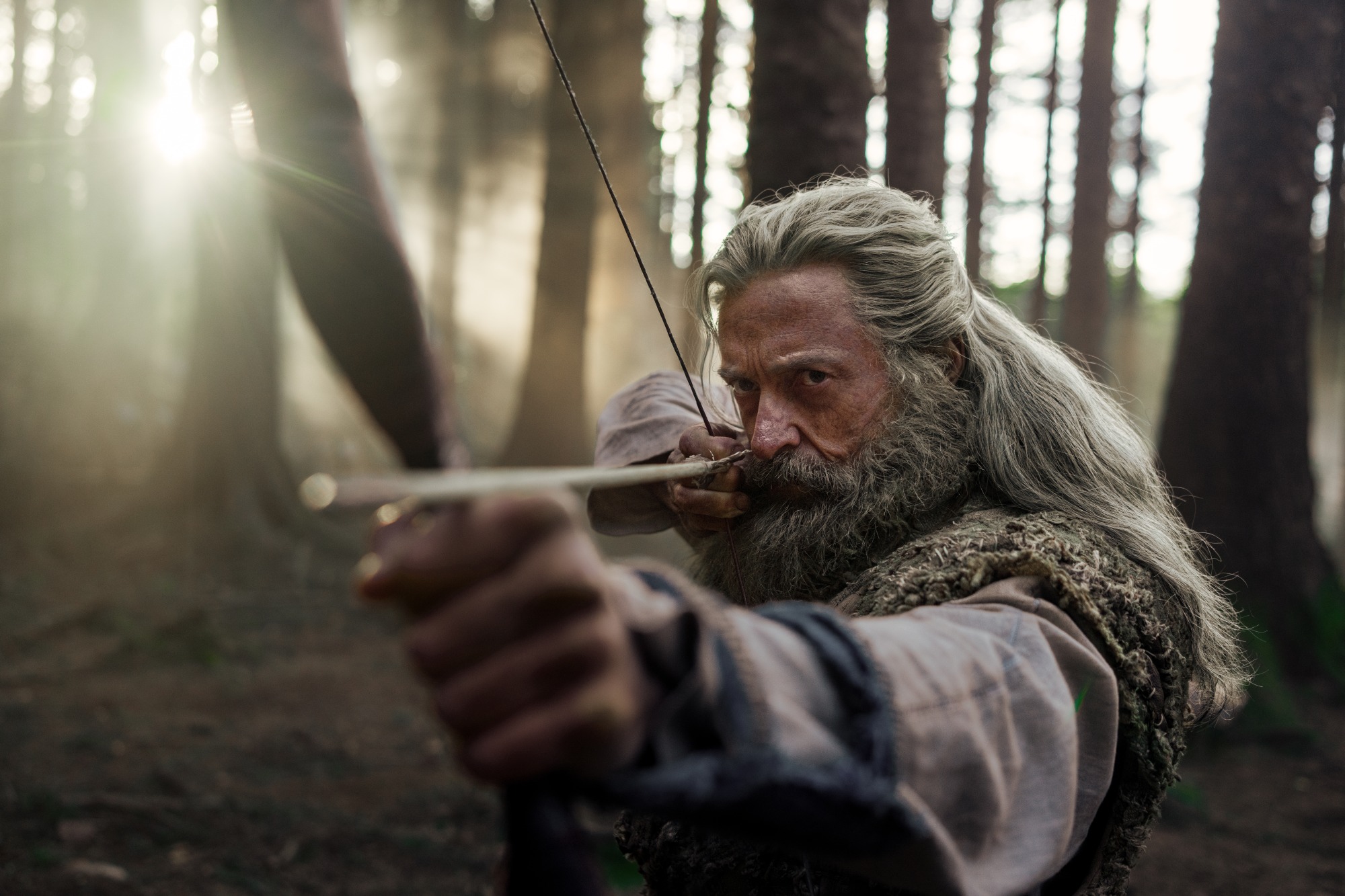 Hugh Jackman shoots an arrow as Robin Hood in The Death of Robin Hood